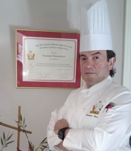 Camosun’s Gilbert Noussitou stands beside his award (photo provided). 