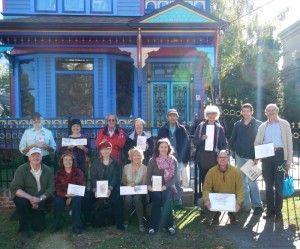 A gathering of participants displaying their artwork at a meet-up of Island Sketching in Victoria (photo provided).