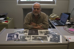 Camosun’s Andy Bryce with pictures of his great-grandfather (photo by Jill Westby/Nexus).