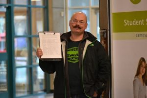 Camosun student Blair Roche and his petition (file photo).